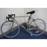 A GENTS RALEIGH ROAD BIKE, bears labels 'Assembled using misc parts avail, soiled !...' and 'Your