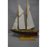 A MODEL OF A SAILING SCHOONER, of wooden construction, in need of minor restoration, length