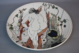PETER WARING, a pottery charger, tube line decorated with the back view of a full length female nude