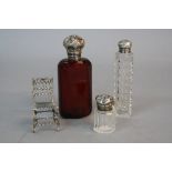 A LATE 19TH CENTURY RUBY GLASS SCENT BOTTLE, facet cut, white metal mounts, height approximately