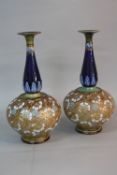 A PAIR OF ROYAL DOULTON AND SLATERS PATENT ONION SHAPED VASES, conical neck with flared rim in