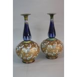 A PAIR OF ROYAL DOULTON AND SLATERS PATENT ONION SHAPED VASES, conical neck with flared rim in