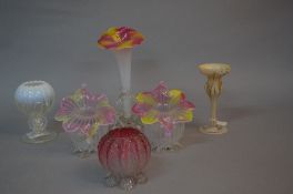 A PAIR OF LATE 19TH CENTURY SPHERICAL GLASS VASES, with flower shaped rim with alternate pink and