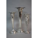 A GEORGE V WILLIAM COMYNS & SONS SILVER TRUMPET SHAPED VASE, embossed floral decoration, London