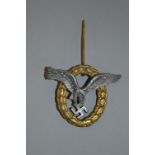 A GERMAN WWII 3RD REICH 'LUFTWAFFE' PILOTS BADGE, gold coloured oval wreath design with silver