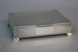 AN ELIZABETH II RECTANGULAR SILVER CIGARETTE BOX, engine turned to top and sides with vacant