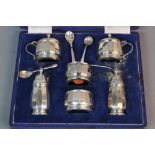 A CASED ELIZABETH II WALKER & HALL SIX PIECE CRUET SET, of dodecagonal form, comprising a pair of