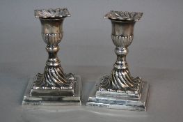 A PAIR OF VICTORIAN SILVER DWARF CANDLESTICKS, removable wavy square sconces with gadrooned