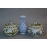 A PAIR OF 20TH CENTURY WHITE OPAQUE JARS AND COVERS, painted throughout with a trailing cornflower