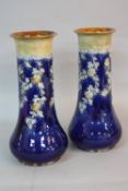 A PAIR OF ROYAL DOULTON STONEWARE VASES, of cylindrical form, with tube line decoration, impressed