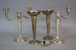 A PAIR OF ELIZABETH II THREE LIGHT CANDELABRA, (one s.d.), on conical tapered stems to a circular
