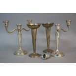 A PAIR OF ELIZABETH II THREE LIGHT CANDELABRA, (one s.d.), on conical tapered stems to a circular