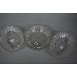 A SUITE OF THREE VICTORIAN CUT GLASS BOWLS, two oval and one circular, all with wavy rims,