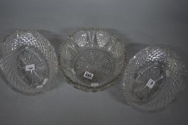 A SUITE OF THREE VICTORIAN CUT GLASS BOWLS, two oval and one circular, all with wavy rims,