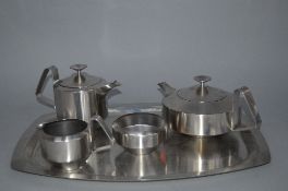 A ROBERT WELSH FOR OLD HALL STAINLESS STEEL ALVESTON FOUR PIECE TEA SERVICE, with an Old Hall