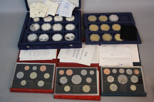A BOXED AMOUNT OF PROOF SILVER COINS, 8 of which are sterling and gold cladded, all of the 30
