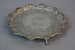 A GEORGE II SILVER SALVER BY EBENEZER COKER, shell and scroll border, later chased foliate