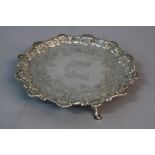 A GEORGE II SILVER SALVER BY EBENEZER COKER, shell and scroll border, later chased foliate