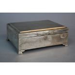 A MODERN SILVER CIGARETTE BOX, of rectangular form, engine turned top, on ogee bracket feet, bears