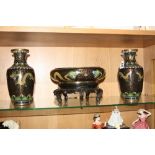 A CLOISONNE GARNITURE, to include a pair of vases and a bowl on stand, depicting Dragon scenes,
