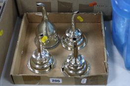 FOUR GEORGE III STYLE EPNS WINE FUNNELS, fitted with clips and sieves