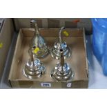 FOUR GEORGE III STYLE EPNS WINE FUNNELS, fitted with clips and sieves