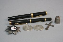 A MIXED BAG, to include two swan pens, two silver 1919 one rupee coins, thimble, cross and badge (