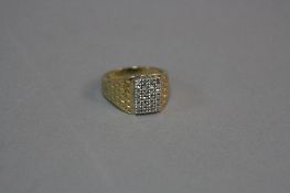 A MODERN GENTS 9CT GOLD DIAMOND SET SIGNET RING, rectangular shaped head, estimated total diamond