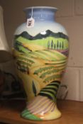 A LARGE OLD TUPTON WARE VASE, tube lined Landscape and Village scene by Jeanne McDougall