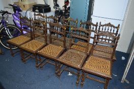 A SET OF TEN OAK FRENCH DINING CHAIRS, with rattan seats on oak frames (sd), rush seats broken to