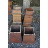 A PAIR OF CHIMNEY POTS, and two treacle glazed bases (4)