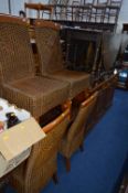 A MODERN MAHOGANY SIDEBOARD, with three drawers and four ducal cane chairs (three keys) (5)