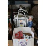 A BOX AND BAG OF USED GOLF BALLS, two pairs of golf shoes and a figure of a golfer