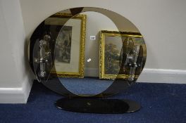 A 1960'S OVAL WALL MIRROR, with another central oval mirror and a pair of lights attached