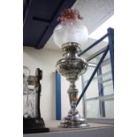 A SILVER PLATED OIL LAMP, with amethyst and opaque glass shade