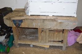 A WOODEN WORK BENCH, with cupboard and a Record vice attached, approximate size width153cm x depth