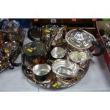 A FOUR PIECE ELKINGTON PLATED TEA SERVICE, together with a three piece Elkington tea service and a