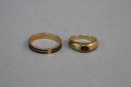 TWO RINGS, to include a black enamelled double band, flat cross section design, ring size W, stamped