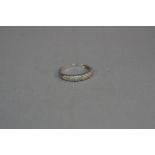 A 9CT DIAMOND BAND RING, ring size M, approximate size 2.2 grams