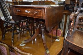 A GEORGIAN MAHOGANY PEDESTAL SOFA TABLE, with a single drawer on brass caps and casters