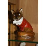A ROYAL DOULTON FOX, dressed in hunting clothes, HN100, approximate height 15cm (cracks to tail)