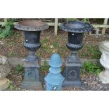 A PAIR OF PAINTED CAST IRON COMPANA GARDEN URNS ON SEPERATE BASES, approximate height 105cm