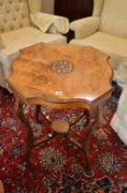 AN EDWARDIAN WALNUT AND INLAID CENTRE TABLE, united by a stretcher (sd)