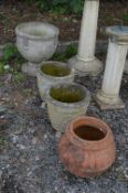 A PRE CAST GARDEN URN, a pair of pre cast garden urns and a terracotta urn (4)
