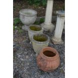 A PRE CAST GARDEN URN, a pair of pre cast garden urns and a terracotta urn (4)