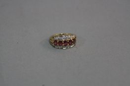 A 9CT RUBY AND DIAMOND DRESS RING, ring size H1/2, approximate weight 2.4 grams