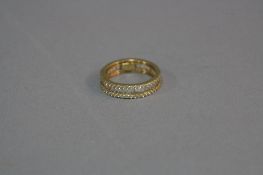 A MODERN CUBIC ZIRCONIA BAGUETTE AND ROUND MISSED CUT FULL ETERNITY RING, ring size O, stamped '