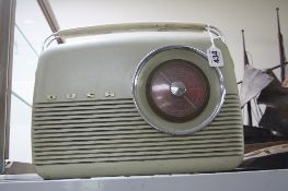 A BUSH VINTAGE TRANSISTOR PORTABLE RADIO, MODEL TR 82C, with instructions