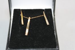 A 9CT AND DIAMOND NECKLACE AND EARRING SET