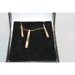 A 9CT AND DIAMOND NECKLACE AND EARRING SET